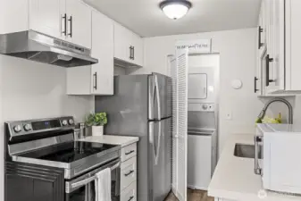 Laundry in closet next to the kitchen.