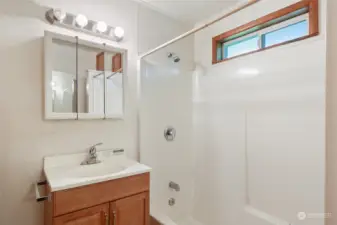 Opening window over shower offers fresh air and light.