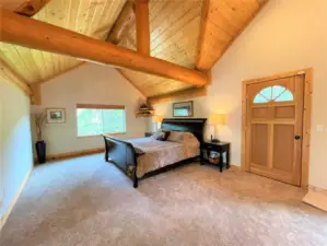 Primary suite - entire top floor. Includes connected bath, WI closet, & office area overlooking great room. King bed shown for reference to scale.