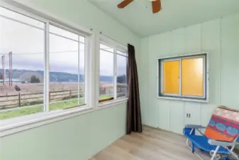 Enclosed porch allows you to take in views of Quilcene Bay while staying warm