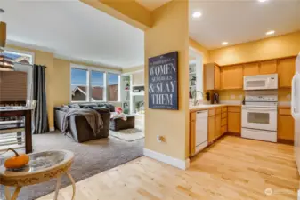 The kitchen features great functionality, beautiful hardwood floors and overlooks the living room