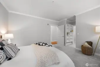 Primary bedroom into walk-in closet and bathroom