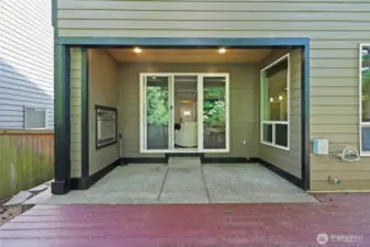 Covered back patio- sliding glass door entry.