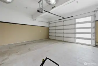 Finished garage with good light and workspace.