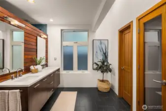 Primary bath features radiant heated floors, walk-in ceramic shower with a soaking tub. There is a build out for a sauna as well.