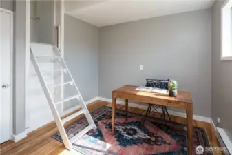 The back room has drop down stairs to the attic.
