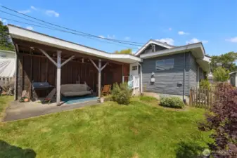 Another view of the rear yard and the carport.
