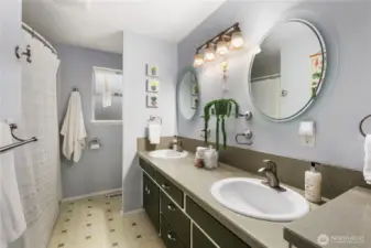 There is plenty of space in the full bathroom which has a dual sink vanity and bathtub