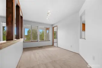 Full sized formal dining room features a serving pass through to the kitchen making entertaining a breeze.