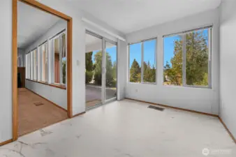 Breakfast nook opens to the patio and features another wall of windows for taking in the view.