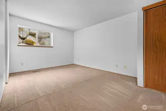 Spacious primary bedroom features 2 separate closets to keep you organized.