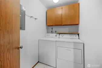 In unit washer and dryer with storage space.
