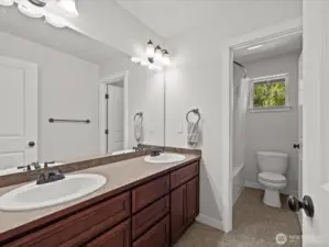 Hallway bathroom with separate area for shower/tub & toilet