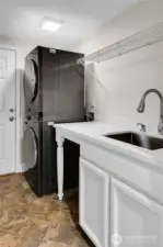 Utility Room off of garage with NEWER High Quality, top of the line, washer & dryer & utility sink.
