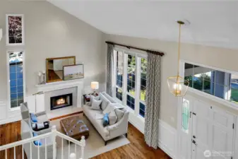 Dramatic & Spacious View of entryway, overlooking formal living room with vaulted ceilings.