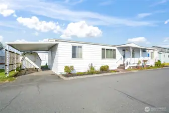 Front of home, showing first parking, and shed