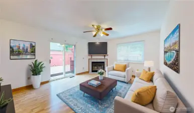 Bright and inviting family room featuring laminate hardwood flooring, cozy gas fireplace with tile surround, and large windows that fill the space with natural light. Photo is virtually staged.