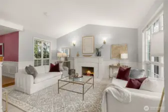 formal living room with lots of light and fireplace