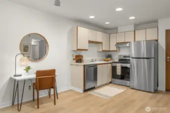 Open studio floor plan with brand new stainless steel LG appliances.