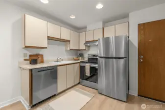 Open studio floor plan with brand new stainless steel LG appliances, new water heater and a newer garbage disposal.