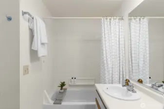Full bathroom features a built-in closet with ample storage.