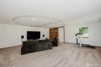 Bonus room with custom lighting and gorgeous cherry Craftsman doors