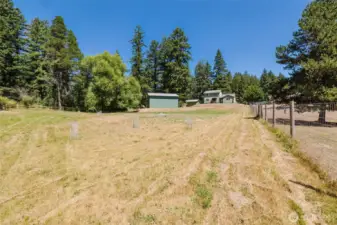 Looking back at the house and shop in the backyard.  Cleared portion of the property is only about 1/3 of all the land.