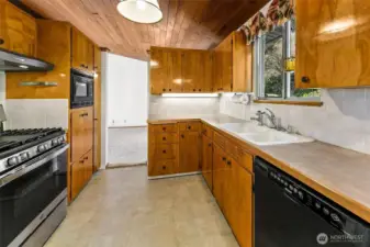 Kitchen passes thru from the dining room and the hallway both