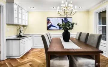 Another view of the formal dining room with glass display cabinets and tons of storage for china glassware.