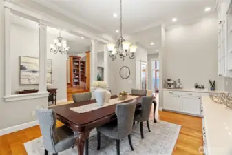 Formal dining area with beautiful white oak floors and built-in storage.