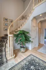 Entrance hallway with stairs to the upper level.
