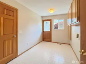 Laundry/ Mudroom Leads to Garage and Backyard