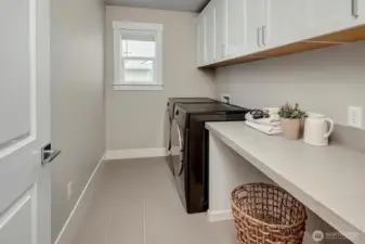 generous laundry room on upper level
