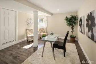 Another view of the extra finished room with laminate flooring.