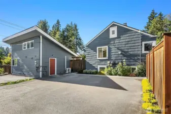 Parking area. Ahead is the primary residence and to the left is the charming, 510 sq. ft. detached ADU with private entry.