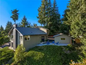 Exterior view with firepit and detached garage