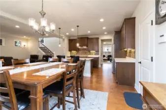 Large dining area with open sightlines to the kitchen and living room.