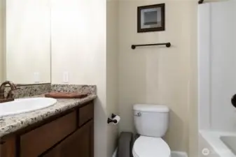 Conveniently located downstairs full bath with stylish finishes for guests.