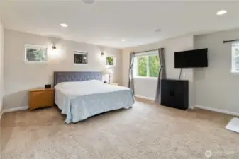 Retreat to this expansive primary suite designed for relaxation and comfort.