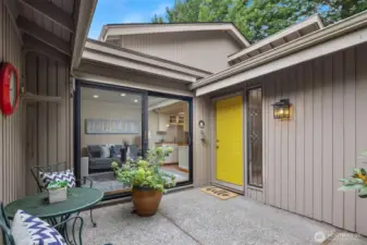 The fully enclosed front patio, accessible from both the entry and family room, sets the scene for this tranquil retreat.