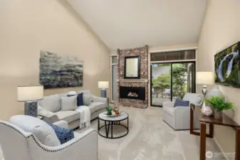 The living room showcases a gas fireplace and a glass slider with a transom window leading to the back patio.