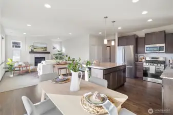 Open concept living, kitchen, dining.