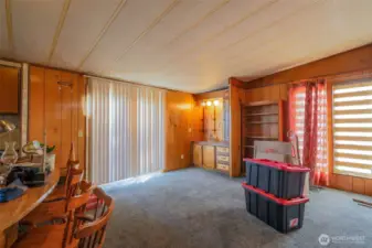 Big open family room with built ins off kitchen