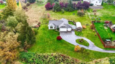 Gently sloping property with paved driveway!