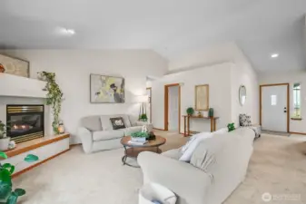 Family room with corner propane fireplace.