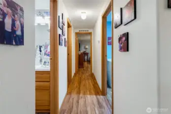 Central hallway leading to the main-level bedroom and primary suite