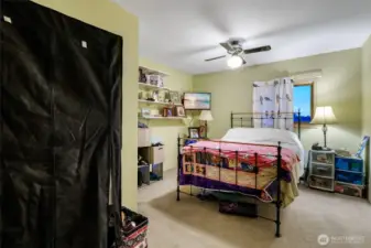 Two additional bedrooms in the upper quarters offer versatility.