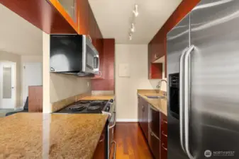 Granite counter tops, wood floor and dual dishwasher