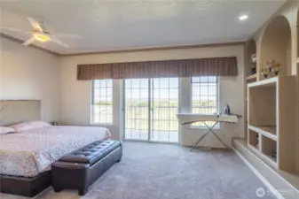 primary bedroom with door to the deck