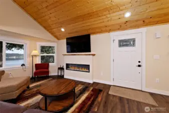 Entry to great room style layout with fireplace.